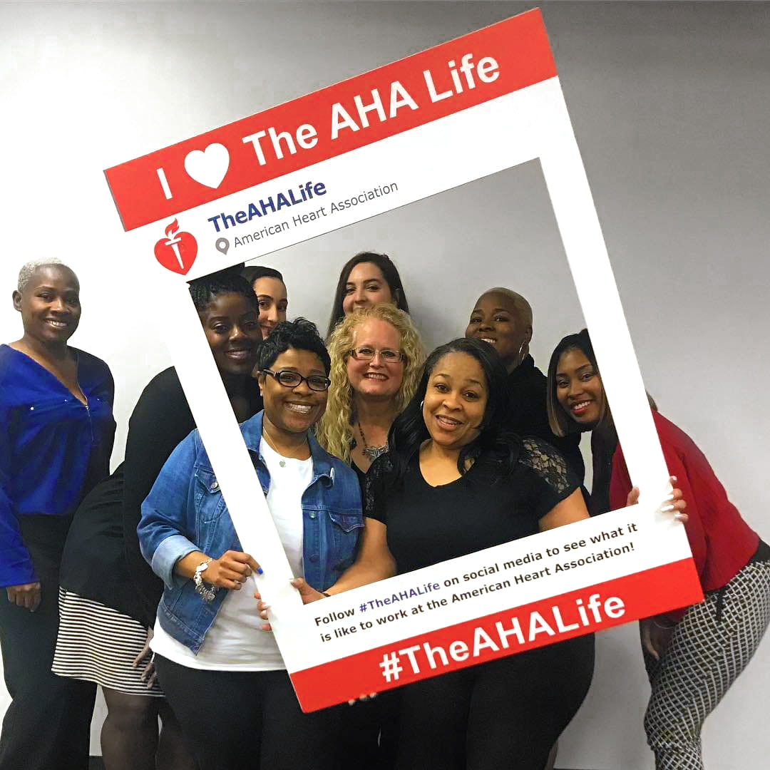 Group of AHA employees posing for social media photo