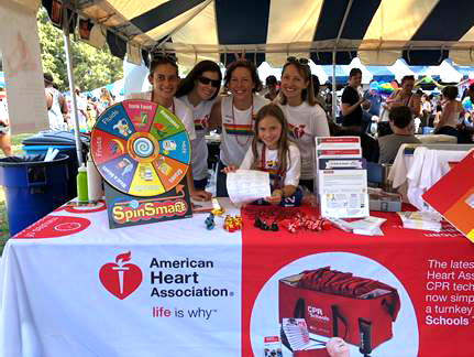 Group smiling at Heart.org tent event