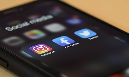iPhone displaying social media icons
