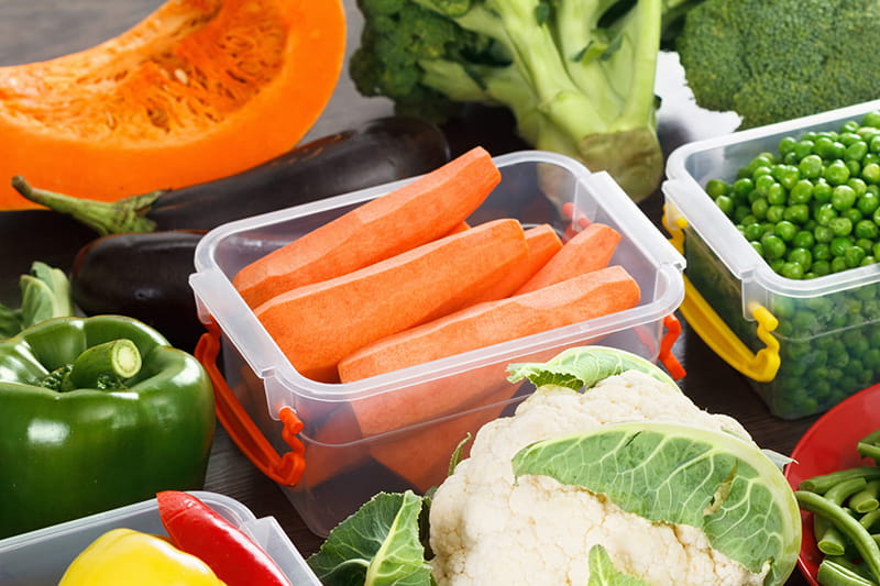 Assorted vegetables in plastic containers