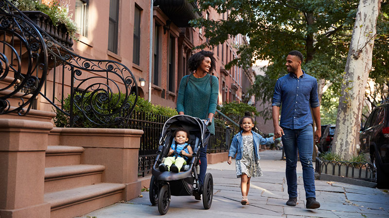 happy family walking in urban outdoors