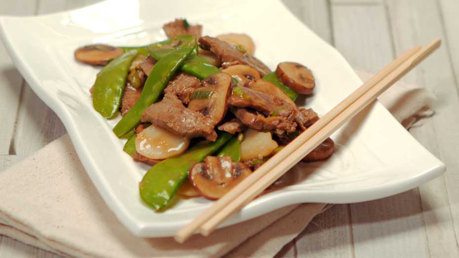 Chinese Flank Steak on a plate with chop sticks