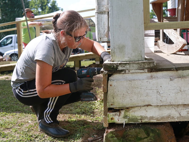 A volunteer from the Hinton Rural Life Center repairing a home to make it safer and healthier. (Photo courtesy of Jared Putnam)