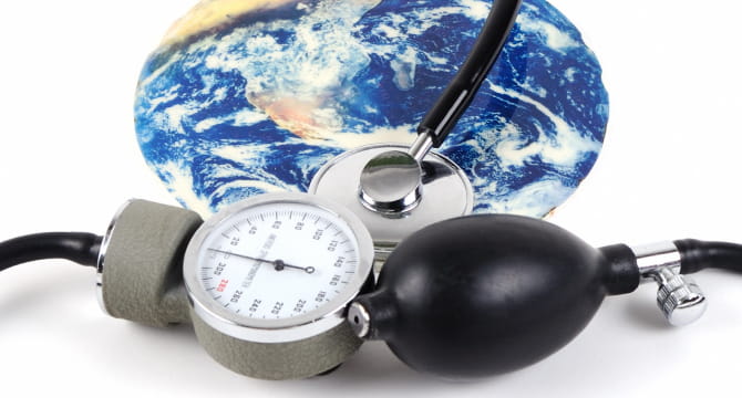 Blood pressure cuff in front of globe