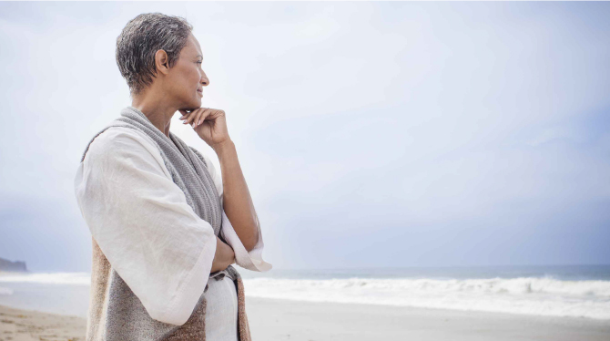 Older woman gazing at beach