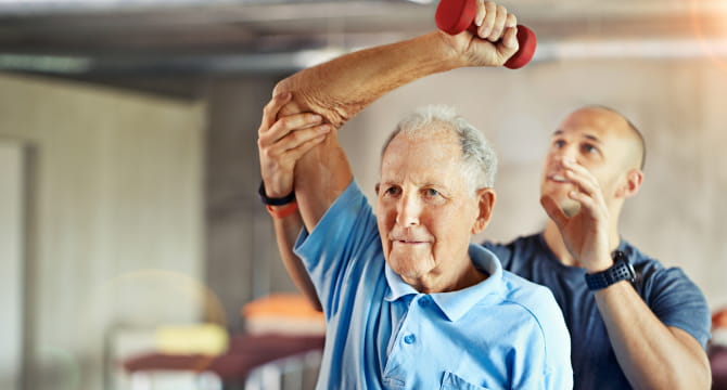 Older man exercising in gym