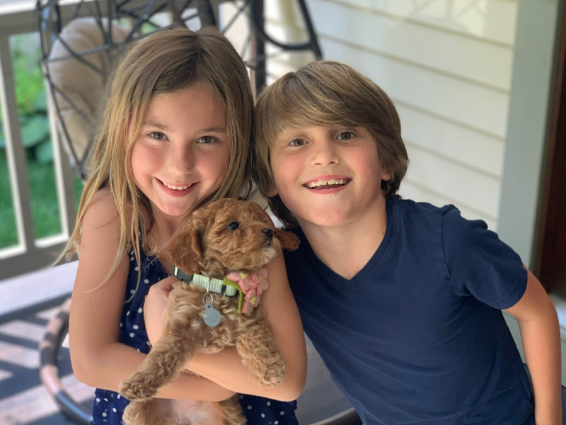 Charlie Timmel (right) and his sister Ella with their new puppy in July 2020. (Photo courtesy of the Timmel family)