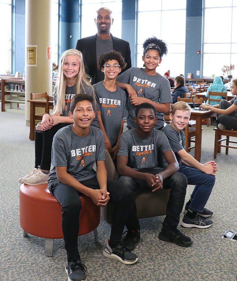 Yonas Michael with students at Ames Middle School. (Photo courtesy of Yonas Michael)
