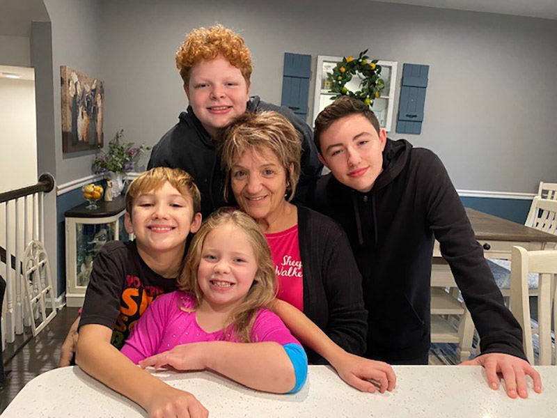 Katherine Romano surrounded by her grandchildren a week after her heart attack, clockwise from bottom: Kayla, Hank, Kody and Ian.  (Photo courtesy of Kristen Emery)
