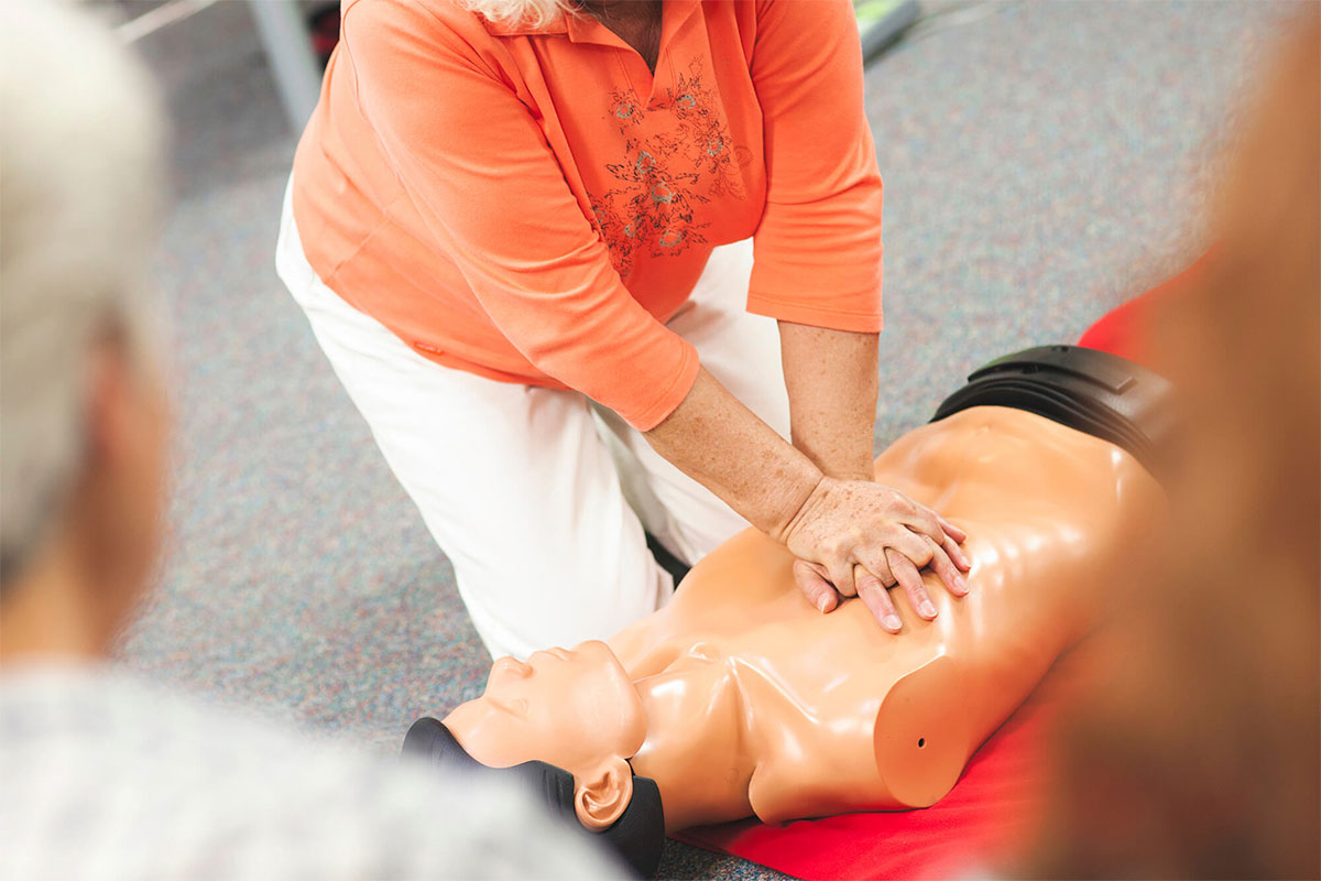 Precticing CPR on a manikin
