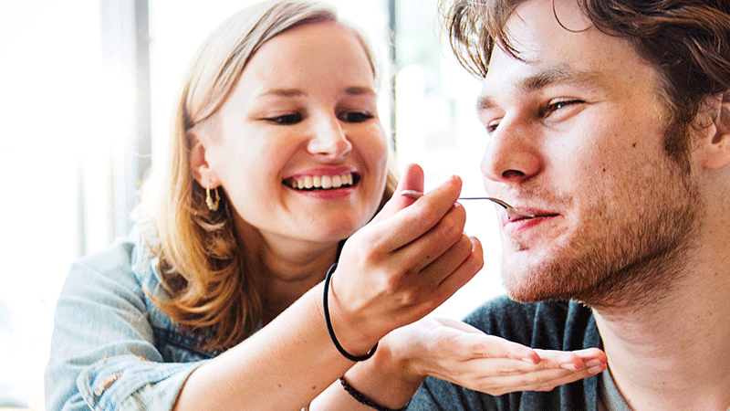 couple tasting food